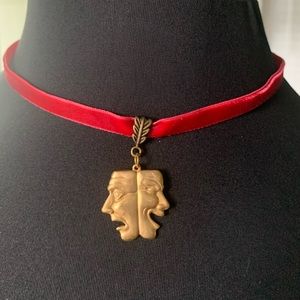 Necklace theater masks on red velvet choker